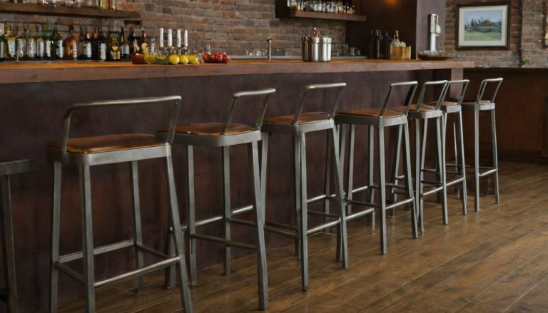 Which metal bar stool dimensions must be fixed before the restaurant bar is built